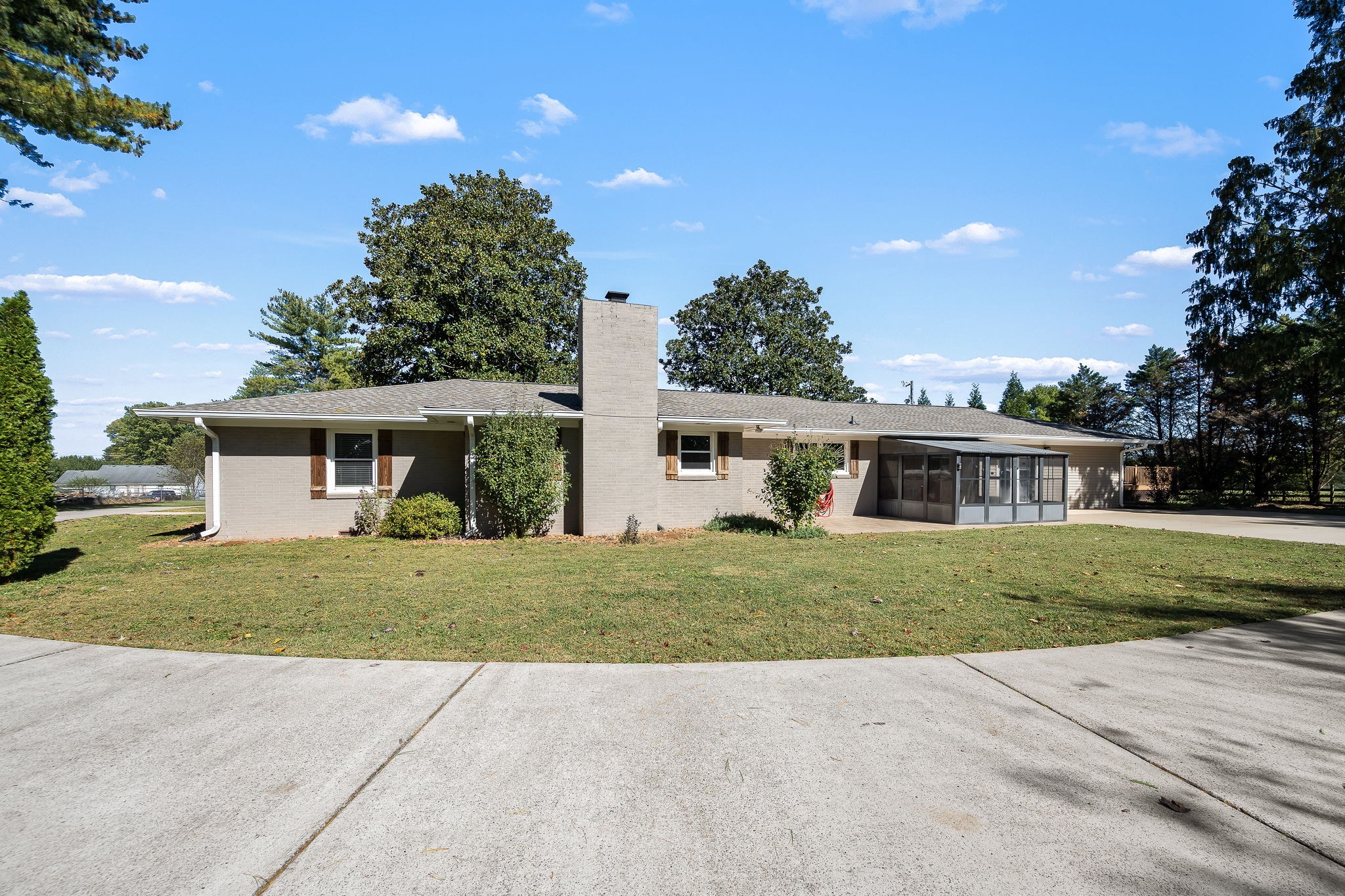 2329 Dilton Mankin Road Murfreesboro, TN 37127 - Photo 81 of 95 a front view of a house with a yard and trees