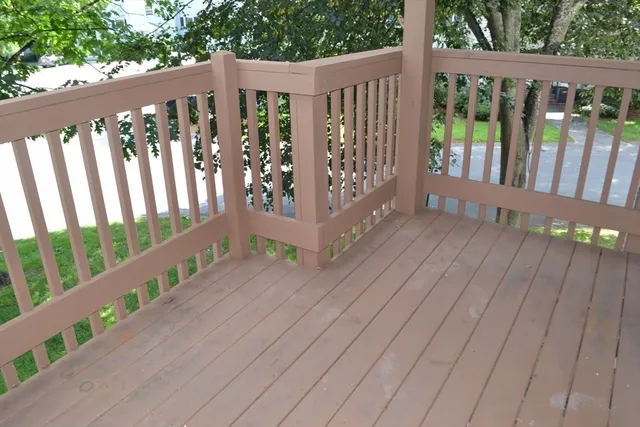 a balcony with wooden floor