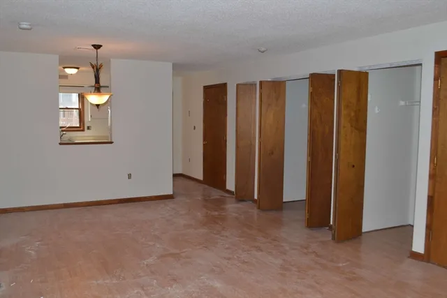an empty room with closet area