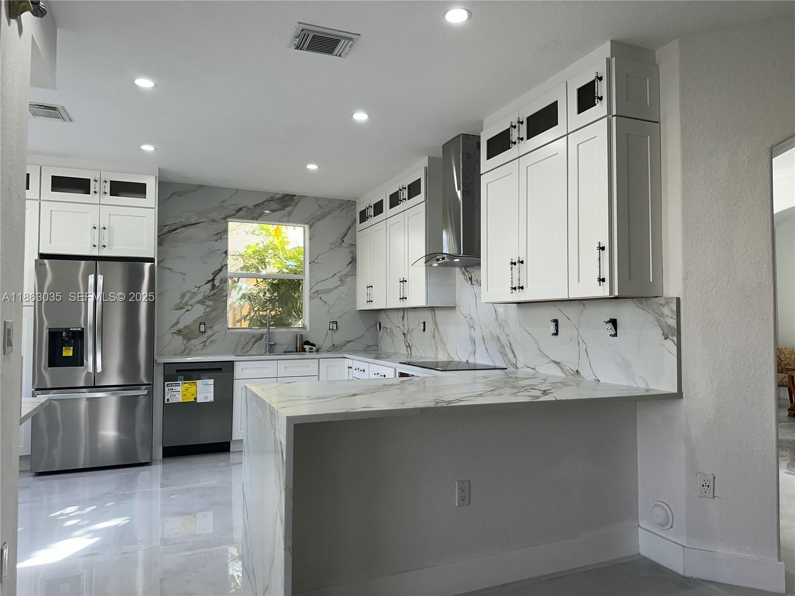 6049 Southwest 165th Avenue Miami, FL 33193 - Photo 1 of 47 a kitchen with stainless steel appliances granite countertop a refrigerator and a stove