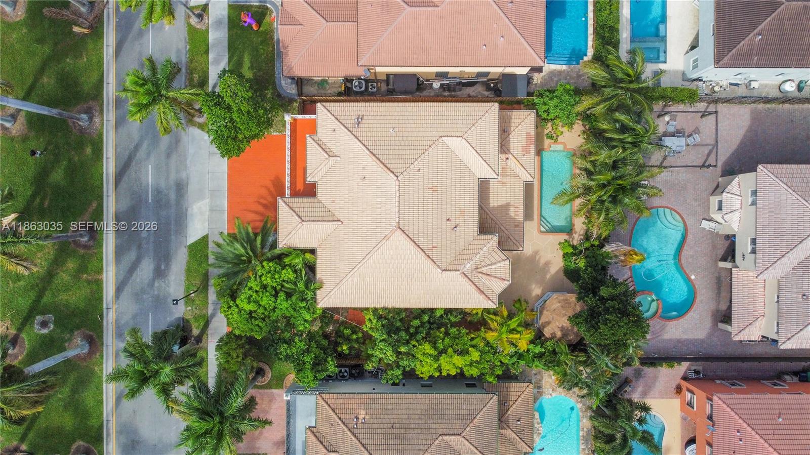 6049 Southwest 165th Avenue Miami, FL 33193 - Photo 35 of 49 an aerial view of a house with a yard and a garden