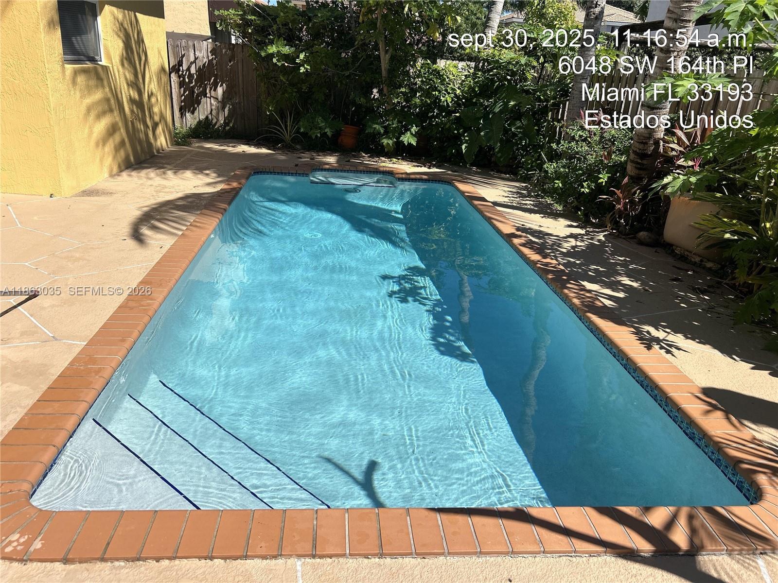 6049 Southwest 165th Avenue Miami, FL 33193 - Photo 40 of 49 a view of swimming pool from a balcony