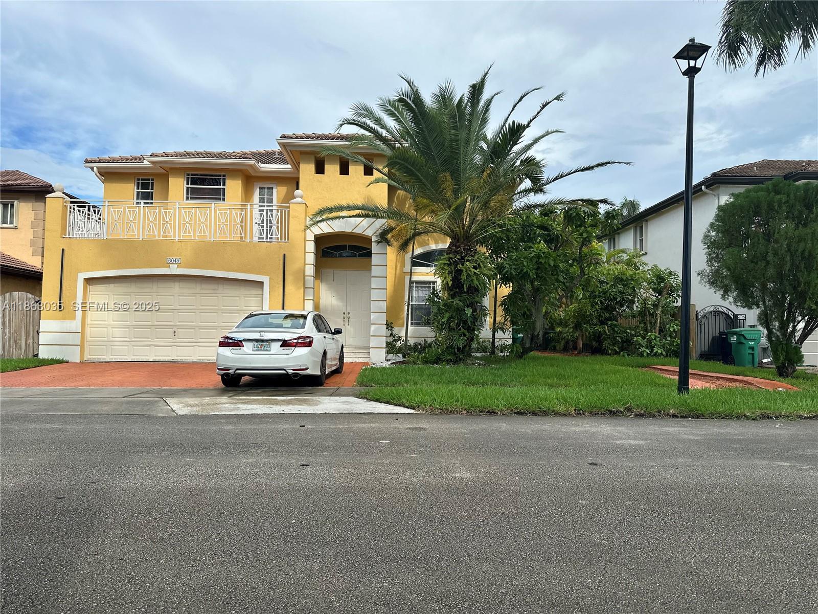 6049 Southwest 165th Avenue Miami, FL 33193 - Photo 41 of 47 a car parked in front of a house