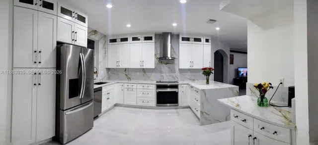 a view of a house with a yard and a garden