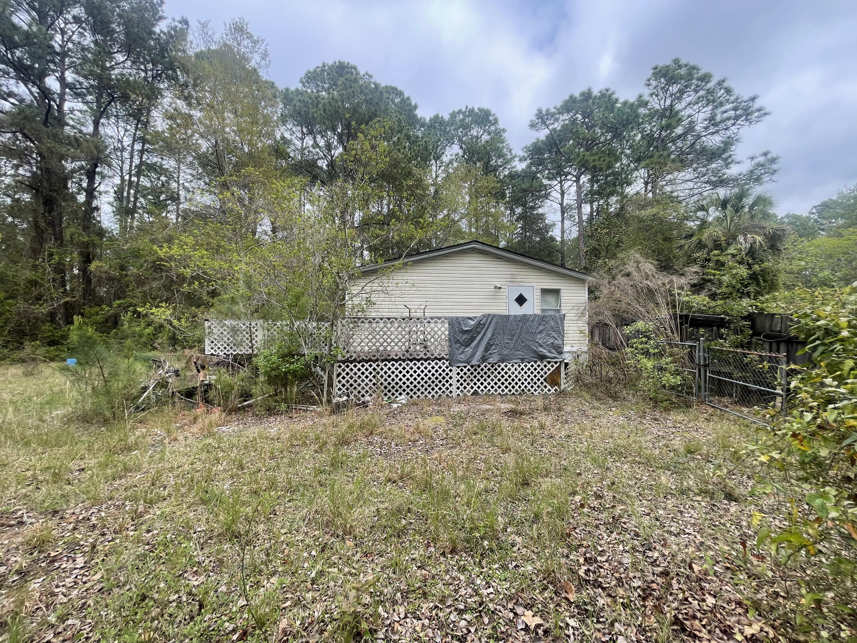 93 Laird Drive Freeport, FL 32439 - Photo 5 of 12 a view of a tiny house with a yard