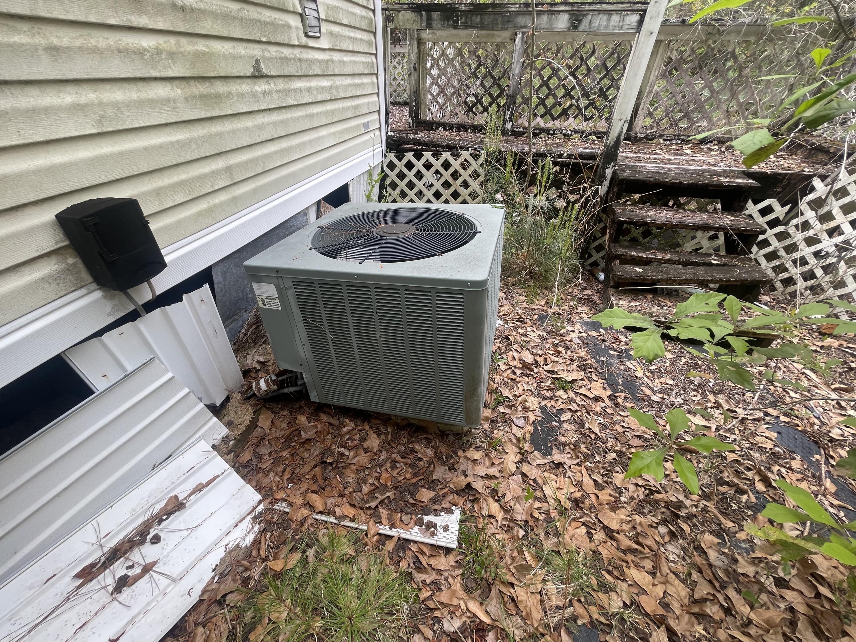93 Laird Drive Freeport, FL 32439 - Photo 8 of 12 a view of a backyard with chairs and stove
