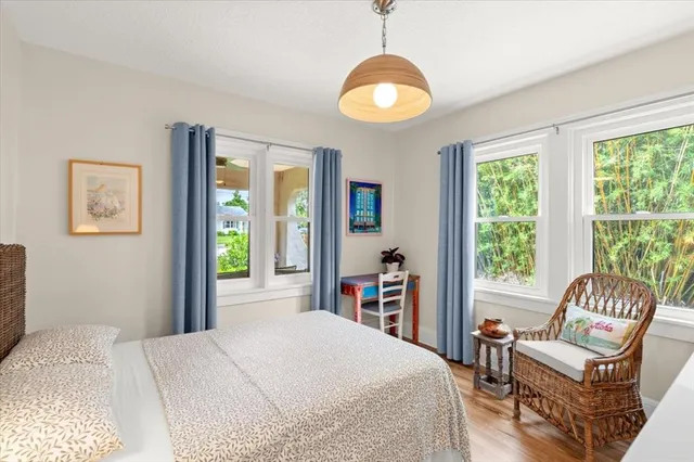 a view of a balcony with wooden chairs