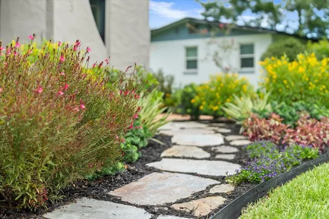a view of a garden with a fountain