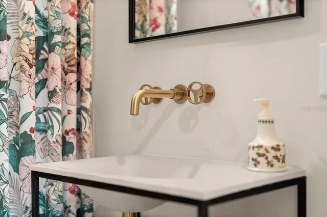 a bedroom with a bed and a table