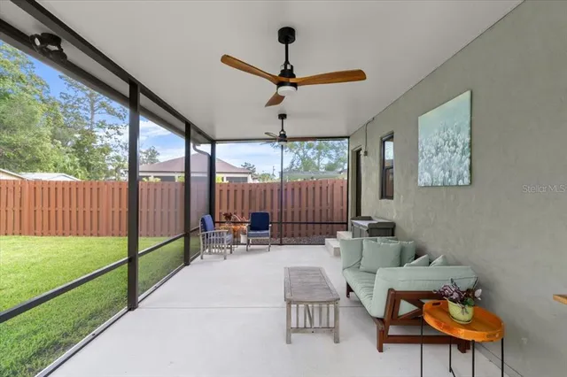 a house view with swimming pool and wooden fence