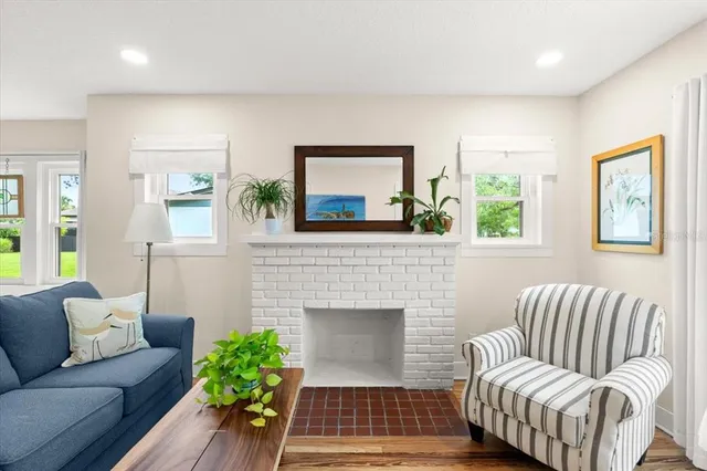 a living room with furniture and a fireplace