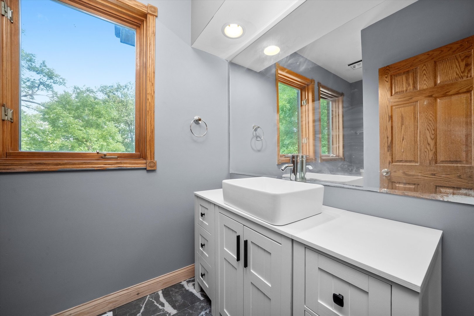 3755 South State Street Crete, IL 60417 - Photo 16 of 48 a bathroom with a sink and a window