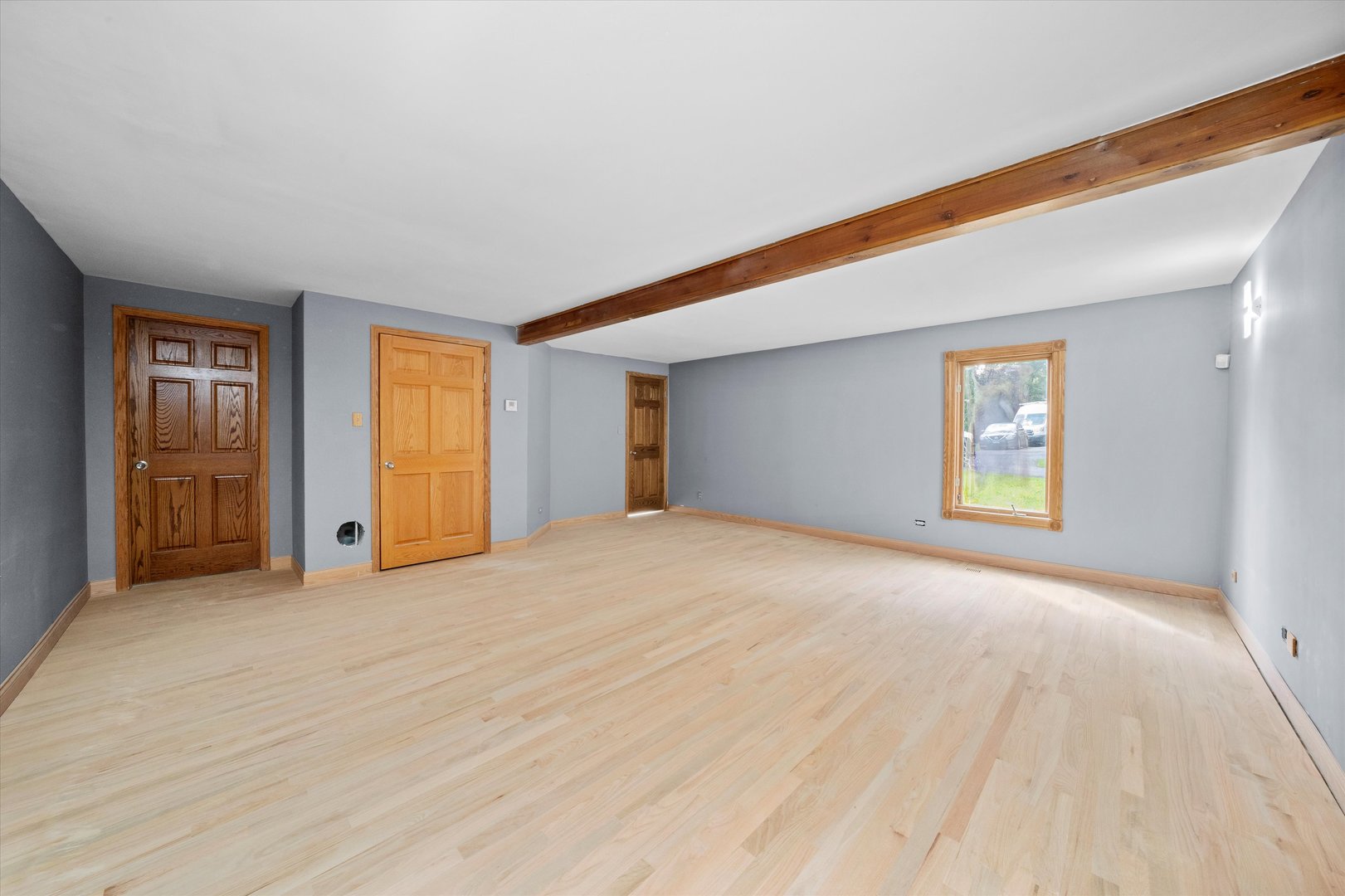 3755 South State Street Crete, IL 60417 - Photo 17 of 48 a view of an empty room with window and wooden floor