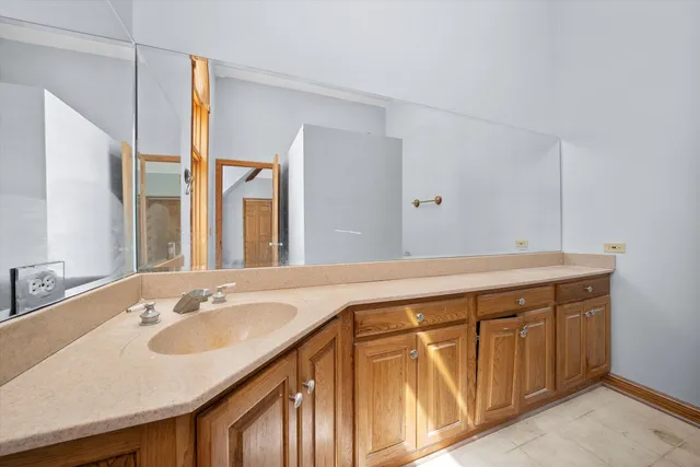 a bathroom with a sink and a mirror