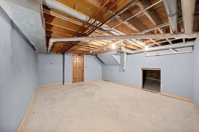 a view of a room with wooden walls