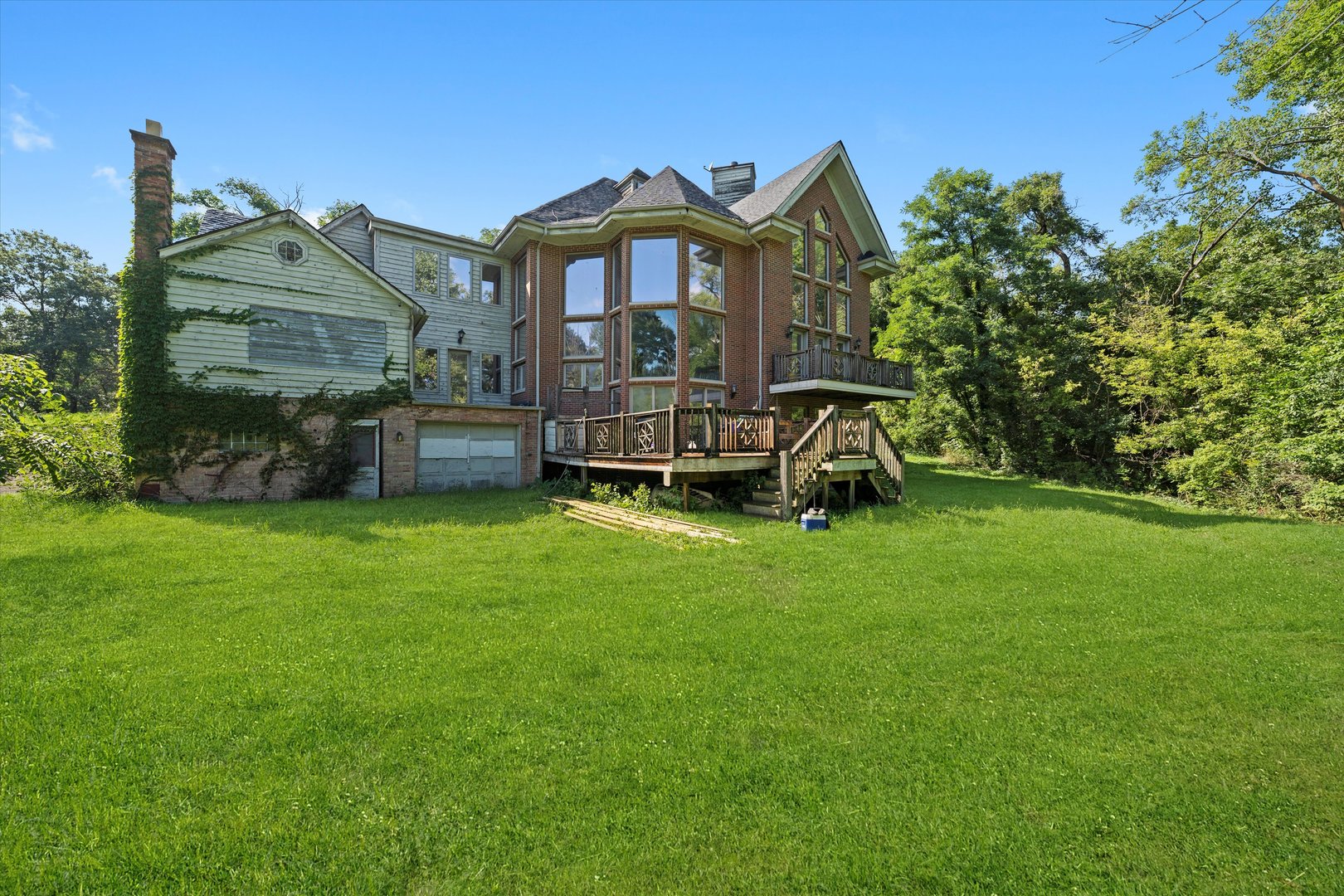 3755 South State Street Crete, IL 60417 - Photo 34 of 48 a view of a big house with a big yard and large trees