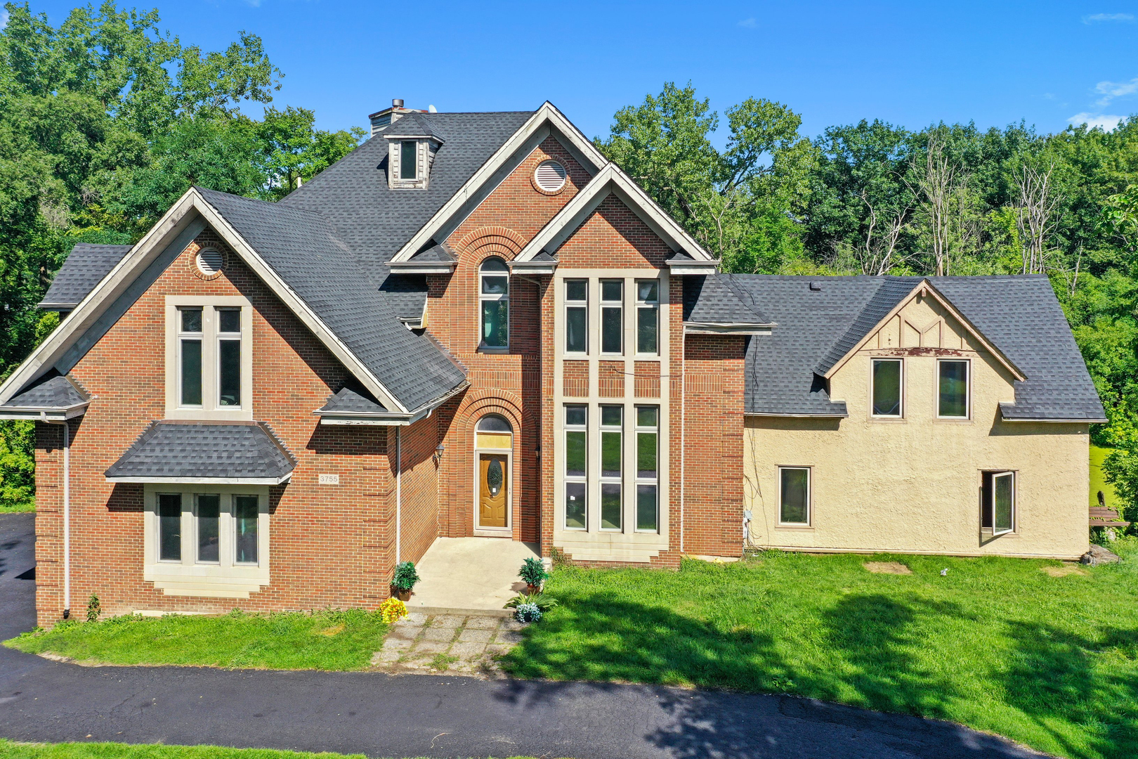 3755 South State Street Crete, IL 60417 - Photo 37 of 48 a front view of a house with a yard and trees