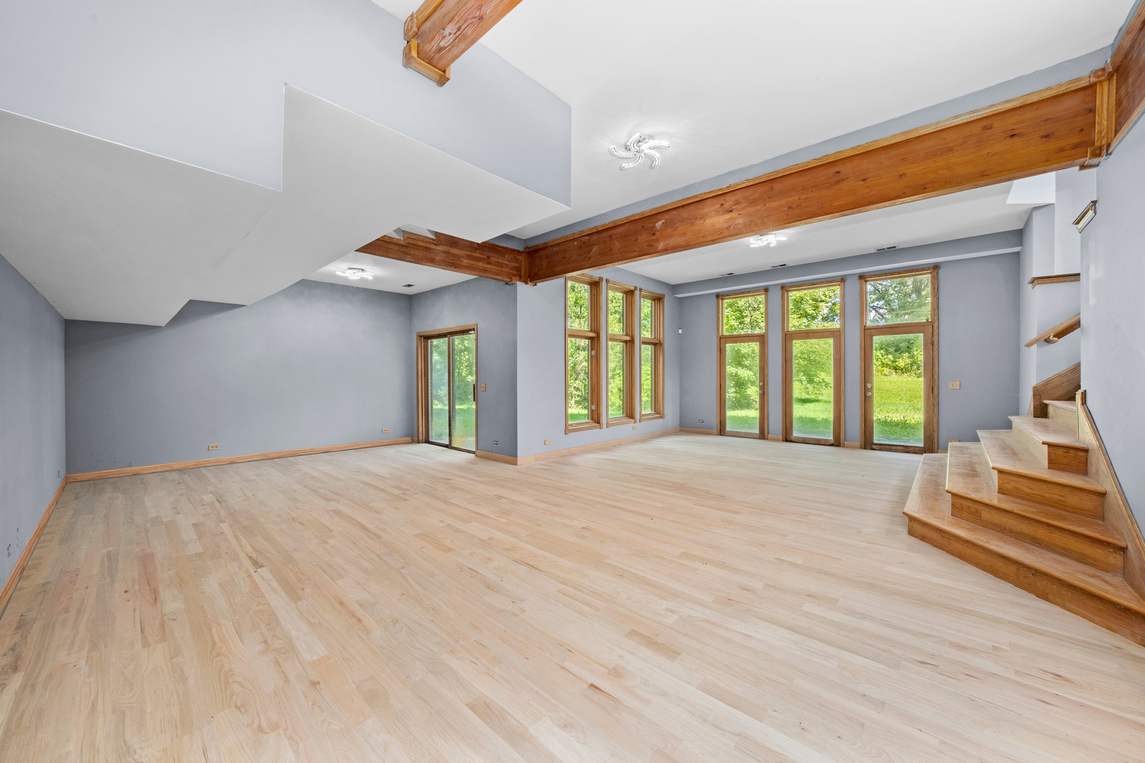 3755 South State Street Crete, IL 60417 - Photo 8 of 48 a view of an empty room with wooden floor and a window