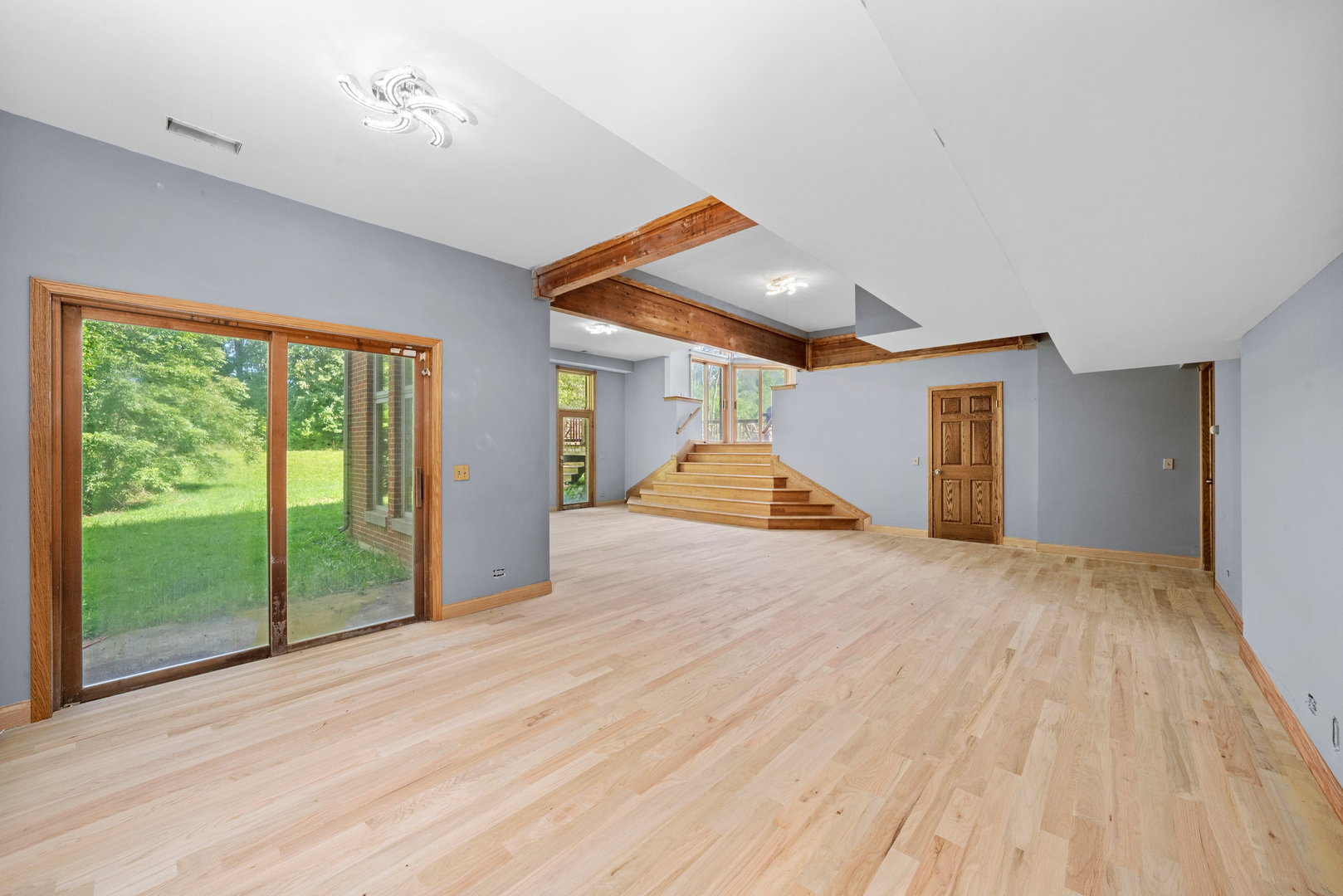 3755 South State Street Crete, IL 60417 - Photo 9 of 48 a view of empty room with wooden floor and fan