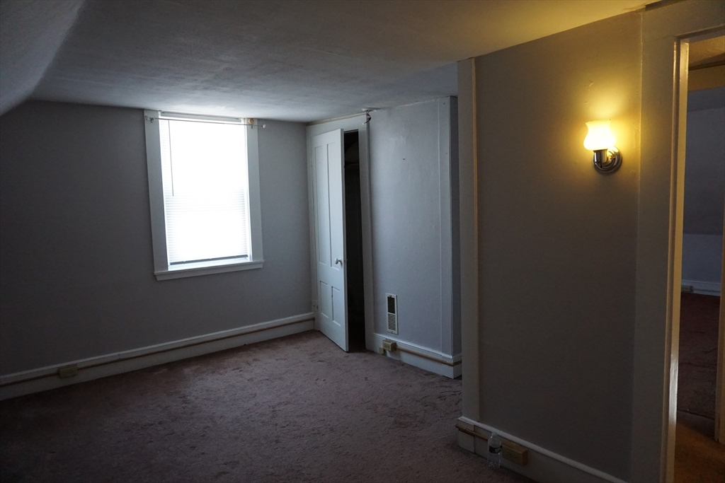5-7 Summer Street Maynard, MA 01754 - Photo 12 of 28 an empty room with windows