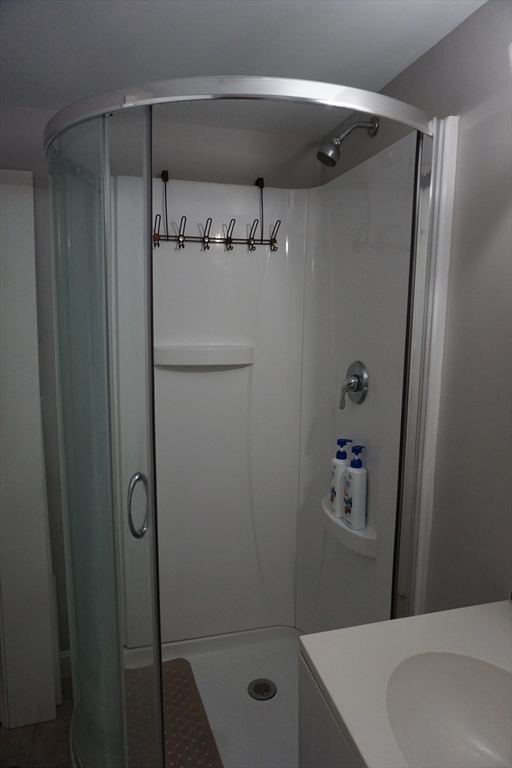 5-7 Summer Street Maynard, MA 01754 - Photo 21 of 28 a bathroom with a shower and a sink