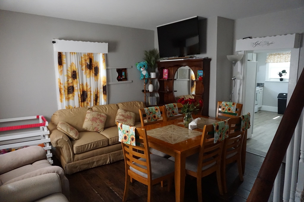 5-7 Summer Street Maynard, MA 01754 - Photo 23 of 28 a living room with furniture and a flat screen tv
