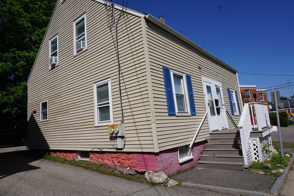 5-7 Summer Street Maynard, MA 01754 - Photo 3 of 28 a front view of a house