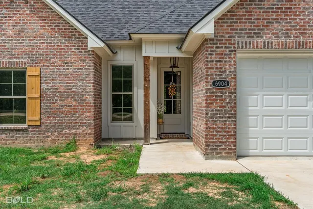 a view of front door of house with stairs