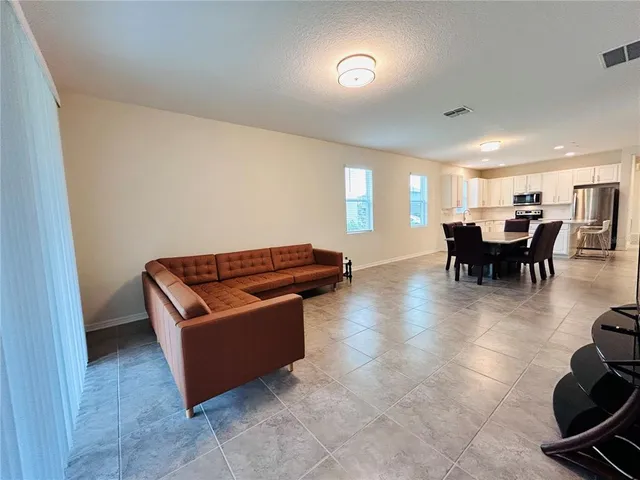 a living room with furniture and a window