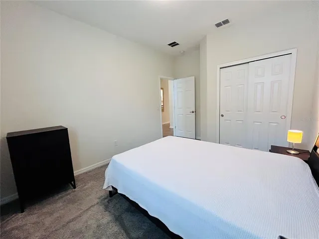 a bedroom with a bed and furniture