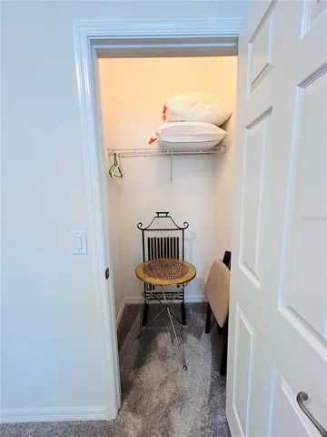 a spacious bathroom with a granite countertop tub sink and mirror