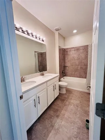 a bathroom with a bath tub and shower