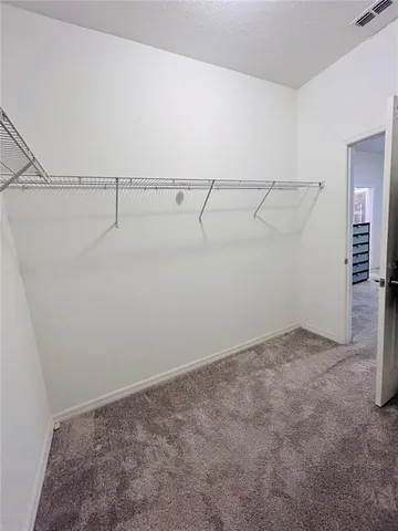 a aerial view of a house with a garden and outdoor seating