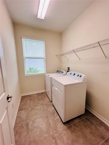 a kitchen with stainless steel appliances granite countertop a refrigerator sink and cabinets
