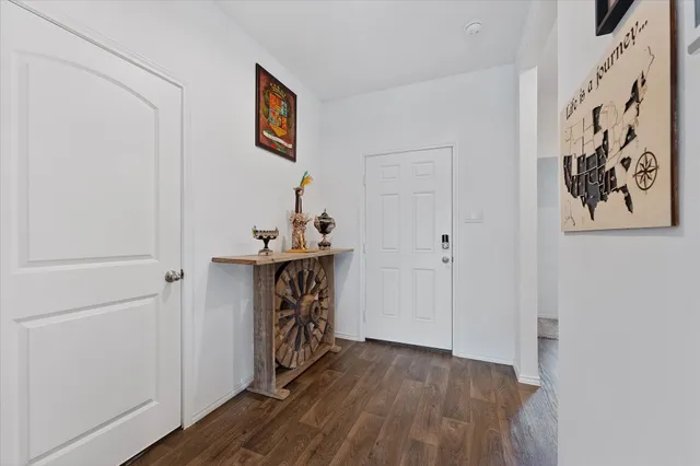 a view of an entryway with wooden floor