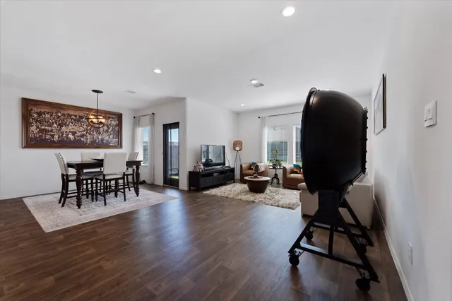 a view of a livingroom with furniture and a workspace