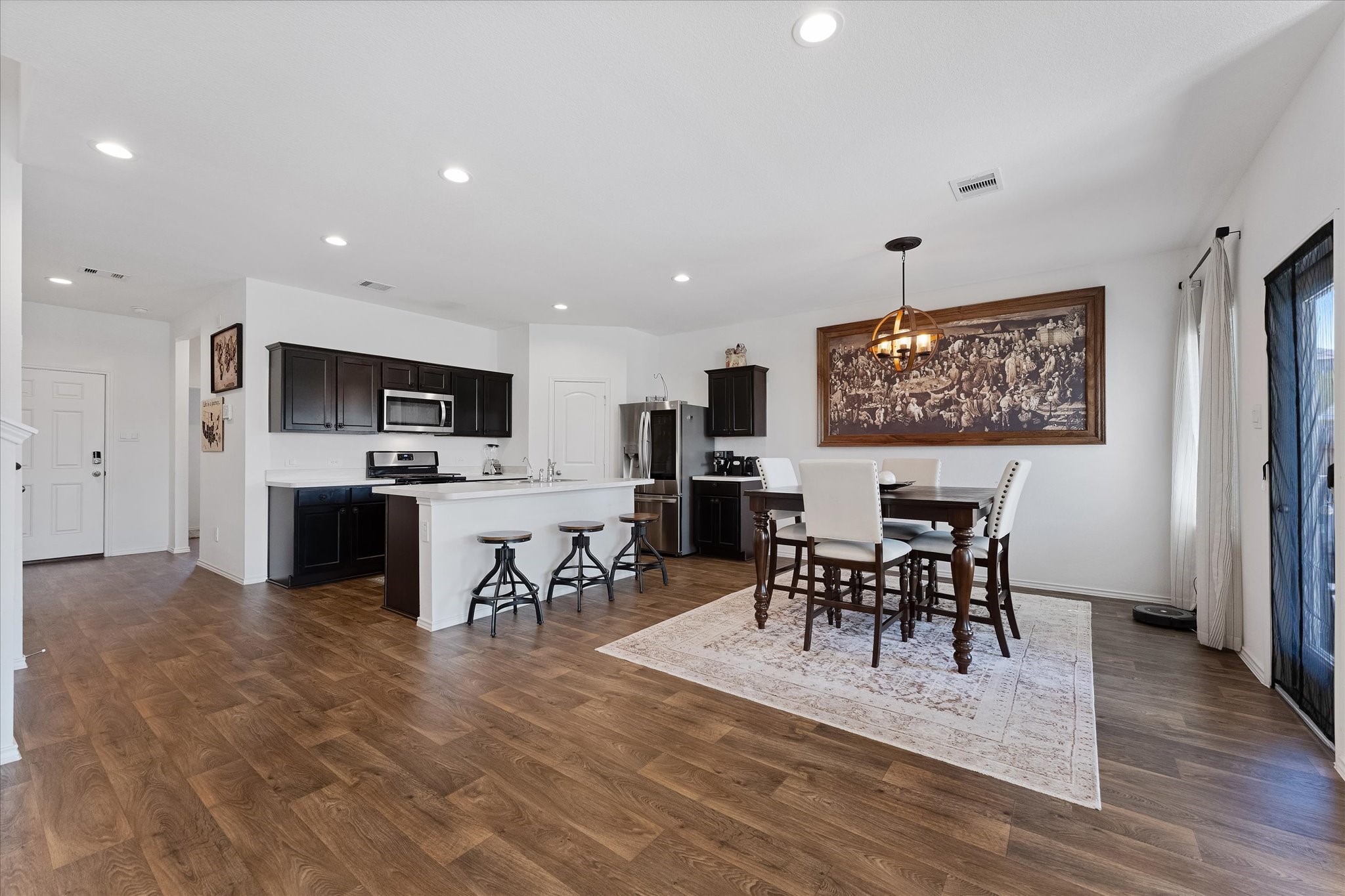 21511 Violet Rdg Road Katy, TX 77449 - Photo 14 of 27 a view of a dining room kitchen with furniture and wooden floor