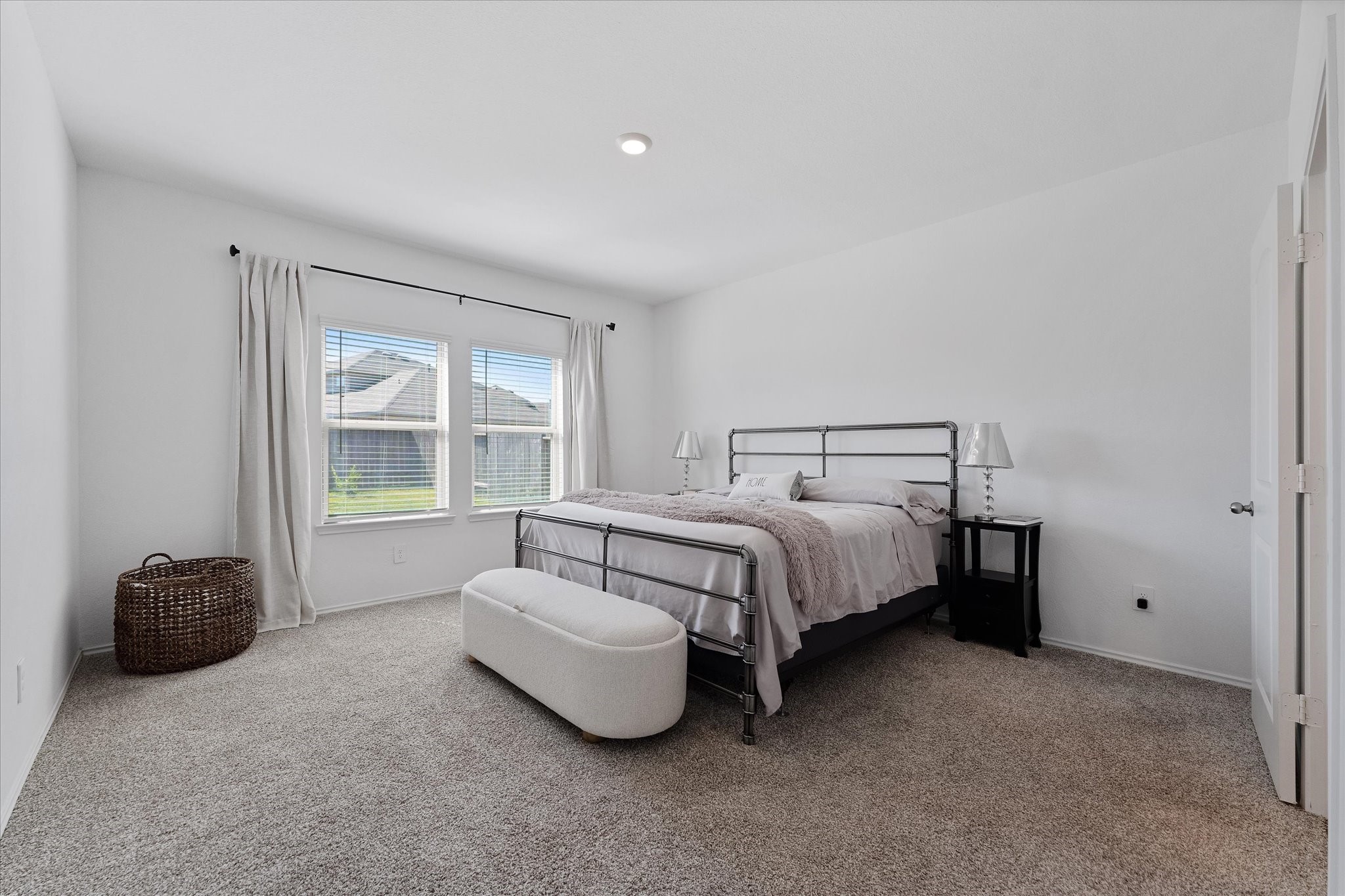 21511 Violet Rdg Road Katy, TX 77449 - Photo 16 of 27 a bedroom with a bed and a couch next to a window