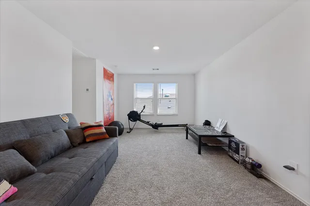 a living room with furniture and a couch