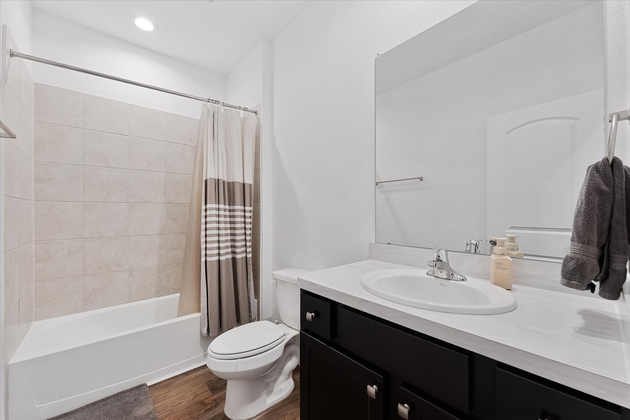 21511 Violet Rdg Road Katy, TX 77449 - Photo 22 of 27 a bathroom with a sink toilet and shower