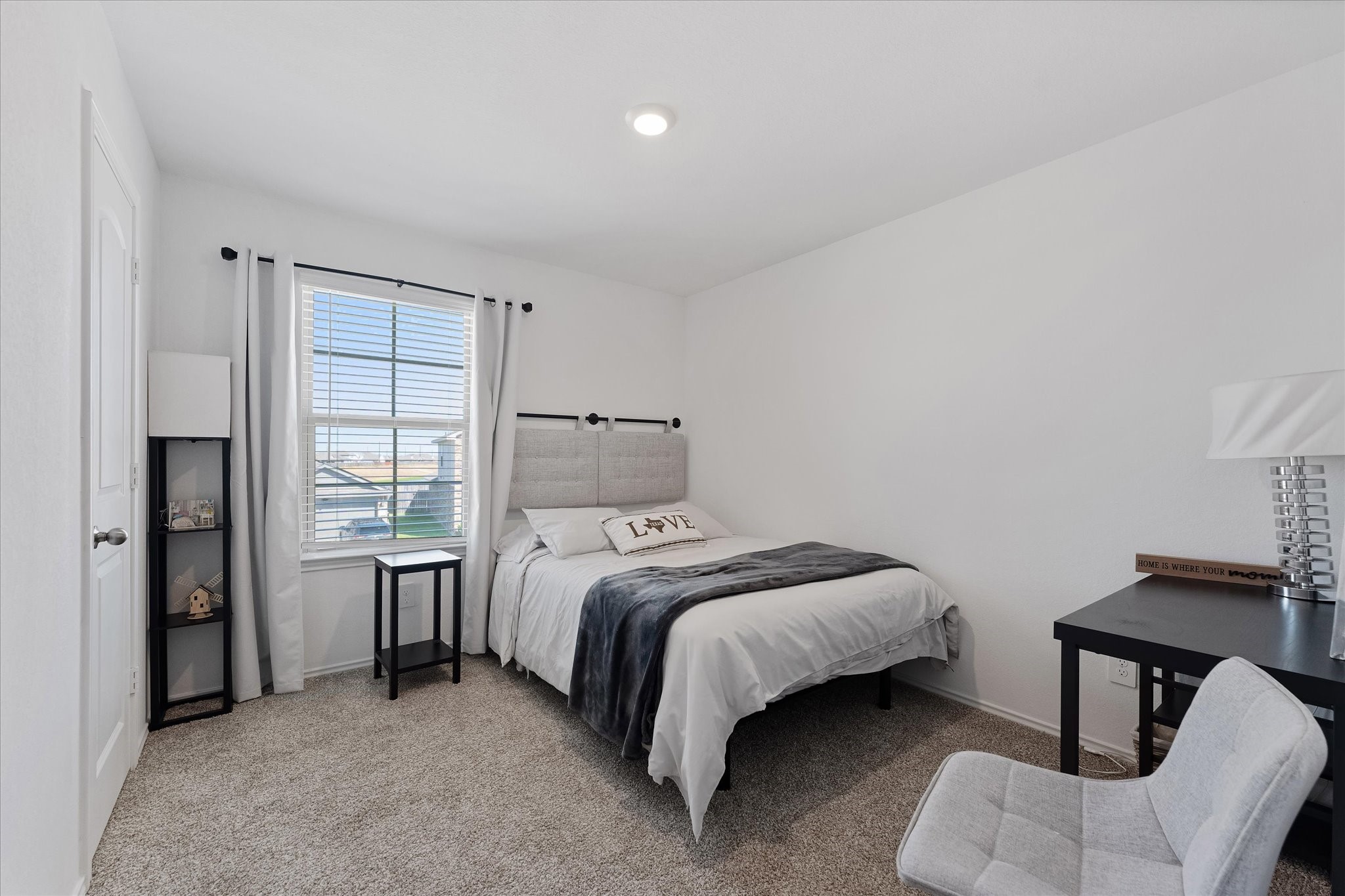 21511 Violet Rdg Road Katy, TX 77449 - Photo 23 of 27 a bedroom with a bed and a chair