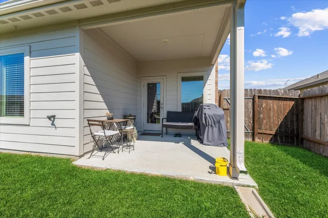 a house view with a seating space and garden