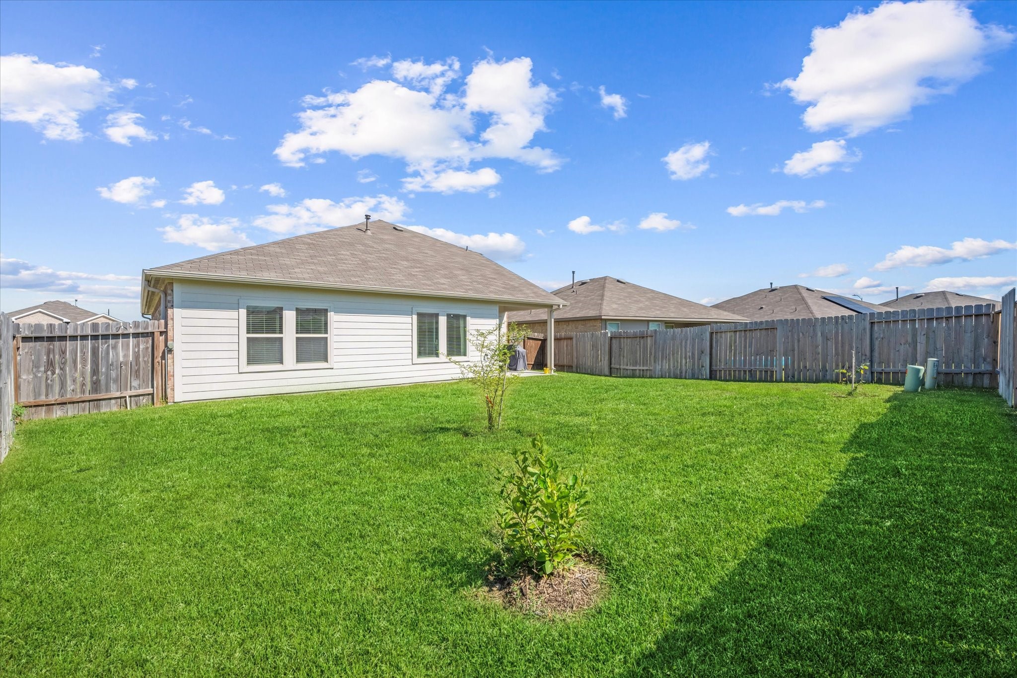 21511 Violet Rdg Road Katy, TX 77449 - Photo 26 of 27 a view of an house with backyard space and garden