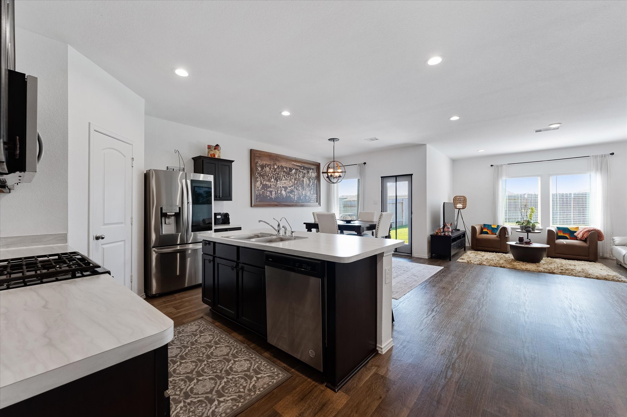 21511 Violet Rdg Road Katy, TX 77449 - Photo 7 of 27 a kitchen with sink stove and refrigerator