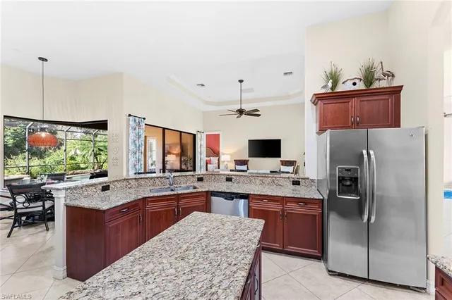 a kitchen with a sink stove and refrigerator