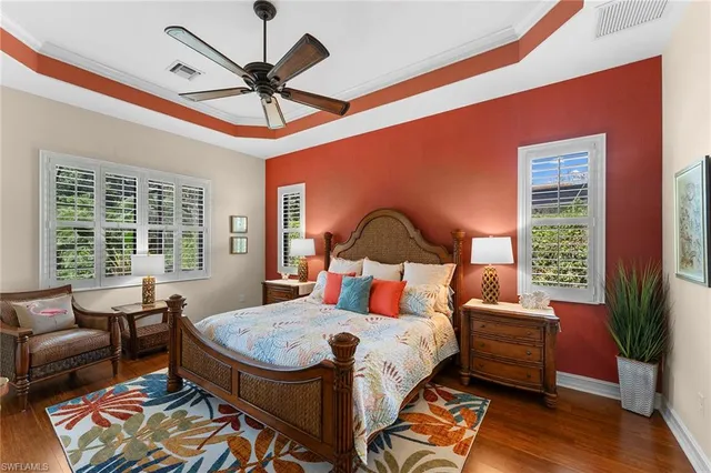 a bedroom with furniture and a large window