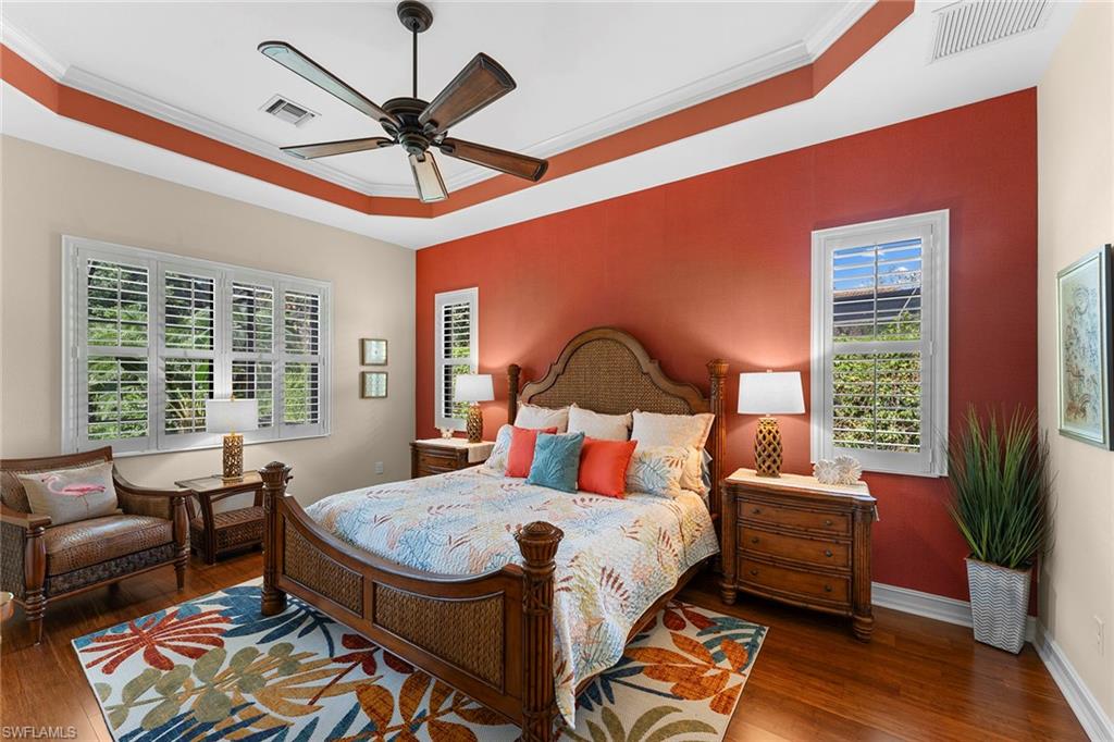 8838 Lely Island Circle Naples, FL 34113 - Photo 31 of 47 a bedroom with furniture and a large window