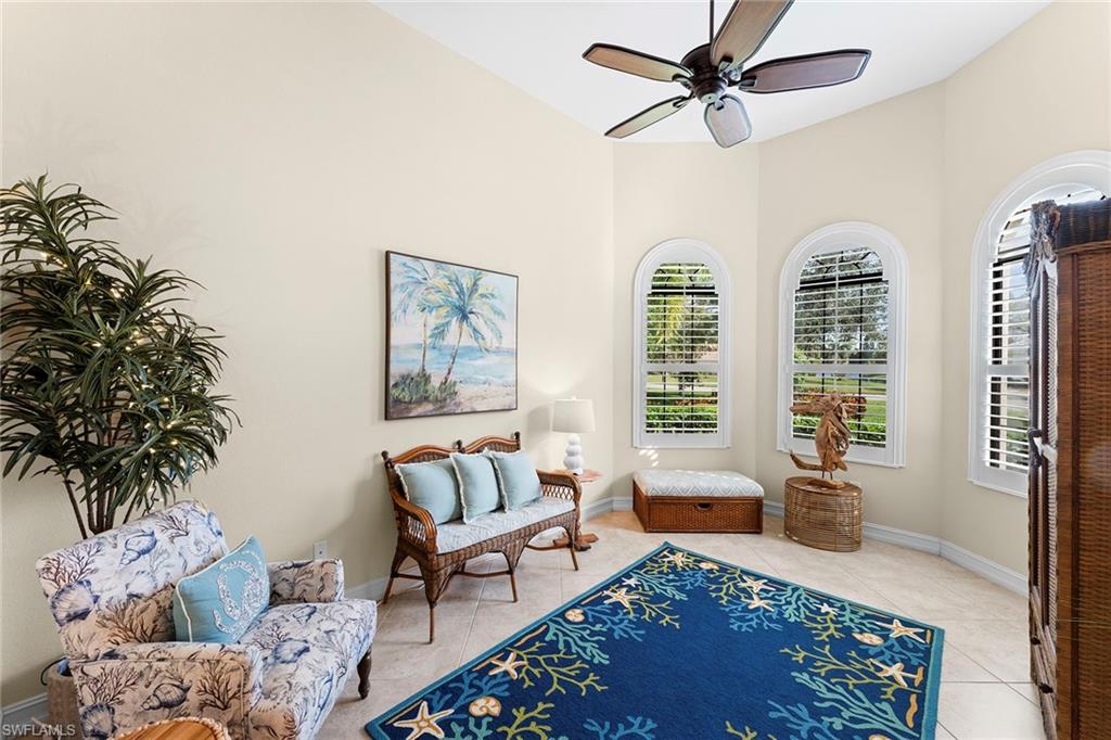 8838 Lely Island Circle Naples, FL 34113 - Photo 5 of 47 a living room with furniture and a window