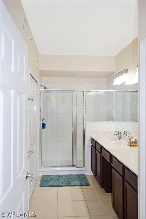 9048 Triangle Palms Lane, Unit 1106 Fort Myers, FL 33913 - Photo 16 of 29 a bathroom with a sink and a mirror