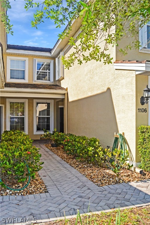 9048 Triangle Palms Lane, Unit 1106 Fort Myers, FL 33913 - Photo 2 of 29 front view of a house